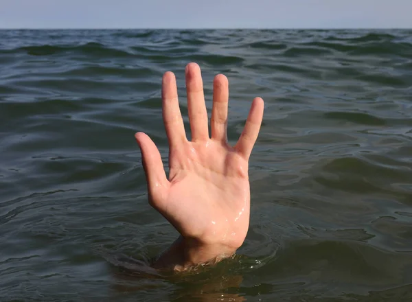 Dramatic Scene Person Open Hand Five Fingers Emerging Surface Sea — Fotografia de Stock