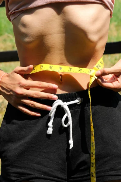 Young Anorexic Teen Girl Eating Disorders Very Skinny While Measuring — Stockfoto