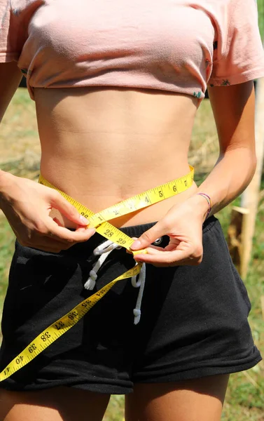 Very Thin Young Student While Measuring Her Waist Using Flexible — Stockfoto
