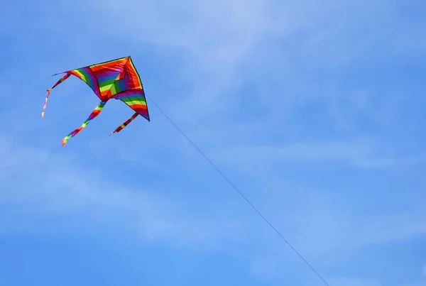 Colorful Kite Many Colors Flies High Sky Tied String — стоковое фото