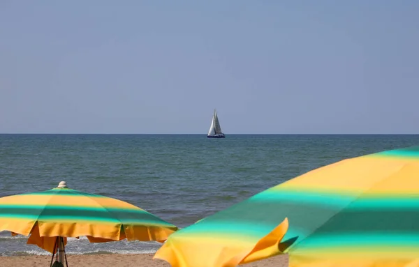 Yellow Green Umbrellas Sun Beach People — стоковое фото