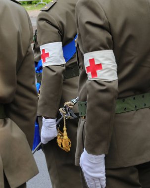 Vicenza, VI, Italy - June 2, 2022: symbol of red cross on the uniform of the nurse soldiers