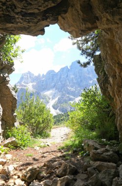view of the beautiful Dolomites mountains photographed from inside a cave dug by soldiers during the First World War