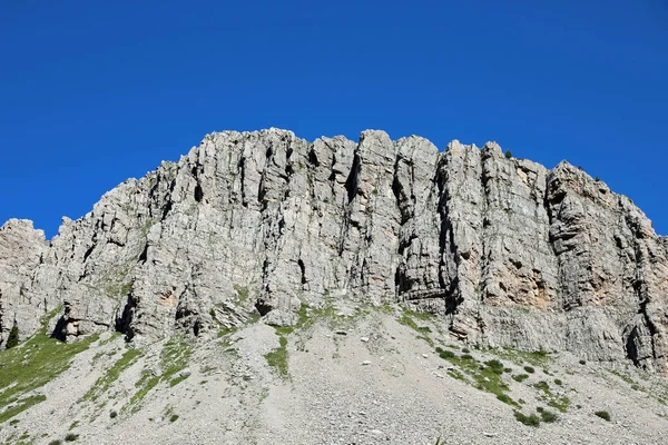 wide rock face of the mountain called MONTE CASTELLAZ in Italian language in South Tyrol near Rolle Pass in Italy