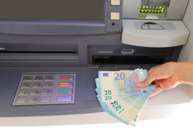 European Euros 20 banknotes at the ATM and the numeric keypad