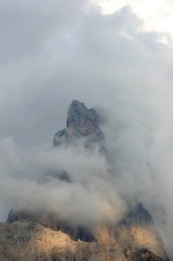 Mountain called Cimon della Pala with white clouds in the Italian Dolomites in summer