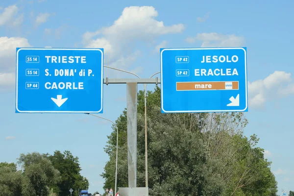 big road signs in the large signs with the Italian seaside resorts