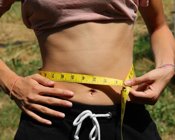 Young Skinny Girl Measuring Her Waist Yellow Measuring Tape — Stockfoto