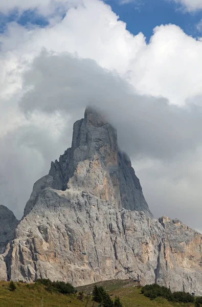 Mountain called Cimon della Pala with white clouds in the Italian Dolomites