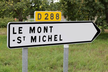 arrow with the inscription LE MONT ST MICHEL place where there is the island of the famous abbey in Normandy in northern France