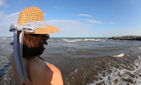 Young Caucasian Girl Straw Hat Looks Sea Shore Summer — Zdjęcie stockowe