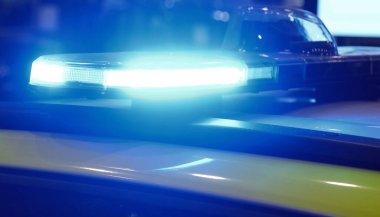 blue flashing of police car siren during emergency at night