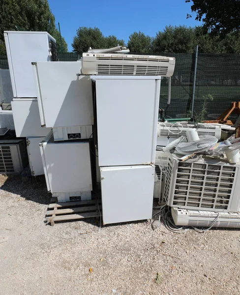 refrigerator appliances and other used and broken electronic equipment in landfill to recycling