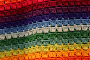 Gökkuşağının renklerine sahip el yapımı kumaşın arkaplanı