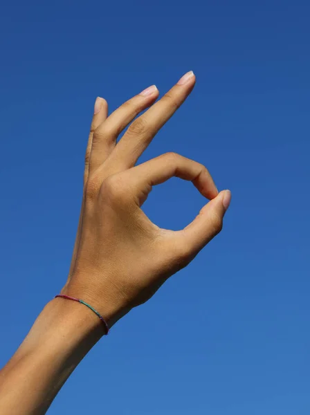 Hand Making Sign Joining Index Fingers Thumb Blue Sky — Stock Photo, Image