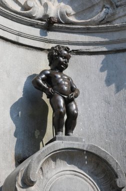 fountain called MANNEKEN PIS with the statue of the child peeing in Brussels Belgium