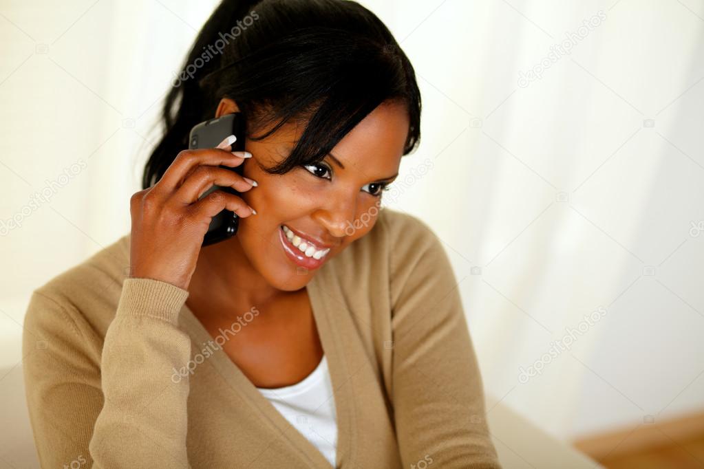 Afro-american woman speaking on mobile phone