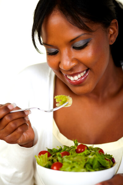 Woman eating fresh salad