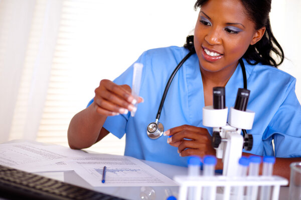 Beautiful nurse working with a test tube