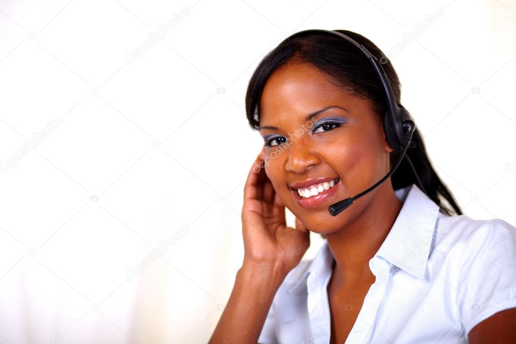 Attractive receptionist smiling and looking at you