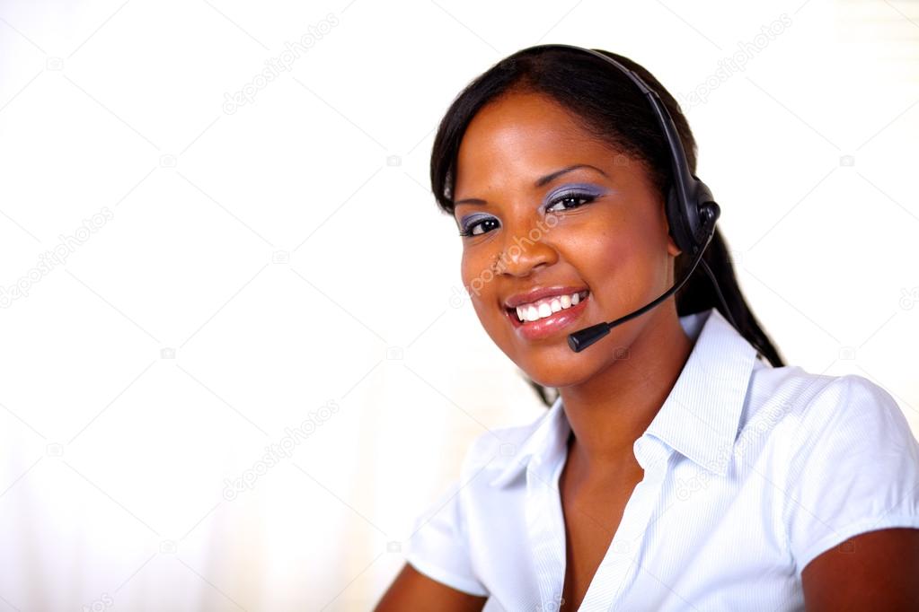 Beautiful receptionist smiling and looking at you