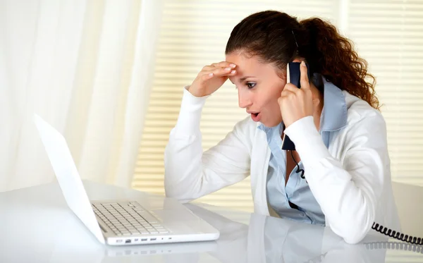 Excited and surprised woman reading laptop screen Royalty Free Stock Photos