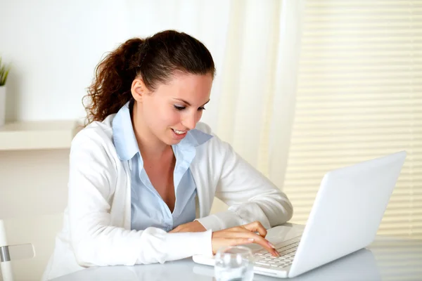 Caucasian young woman browsing the internet Royalty Free Stock Images