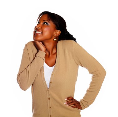 Happy young woman looking up