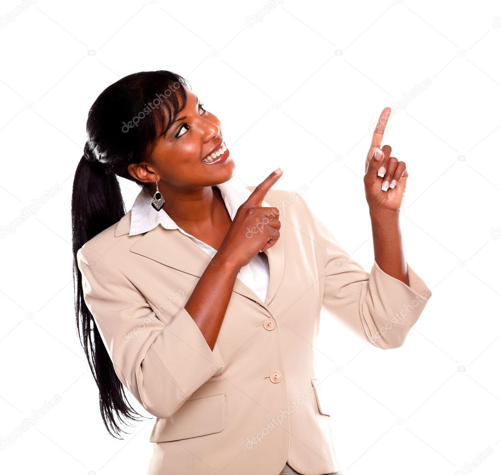 Adult businesswoman looking and pointing up