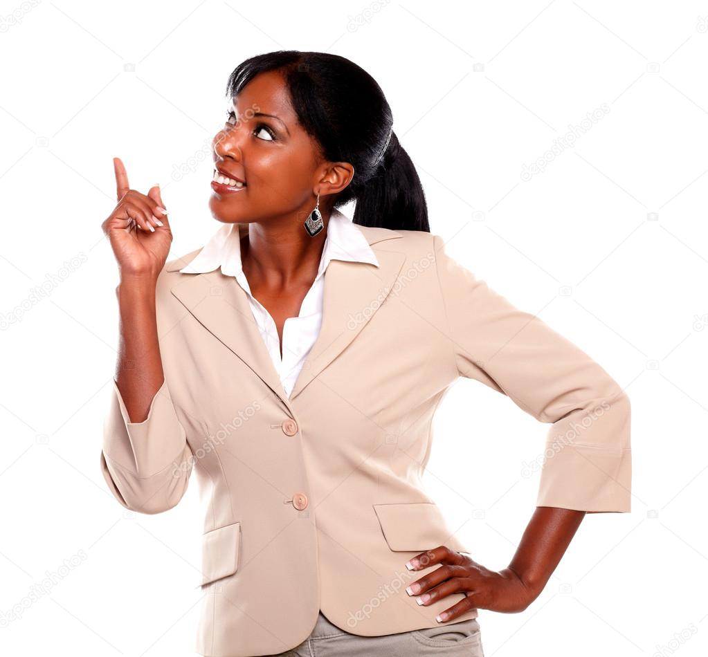 Ethnic businesswoman looking and pointing up