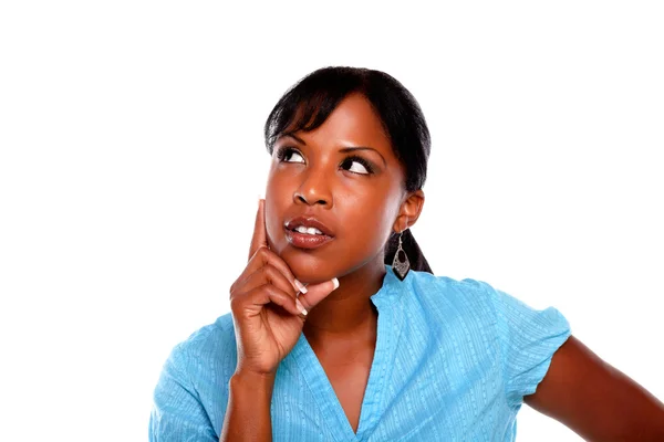 Pensive young black female on blue shirt — Stock Photo, Image