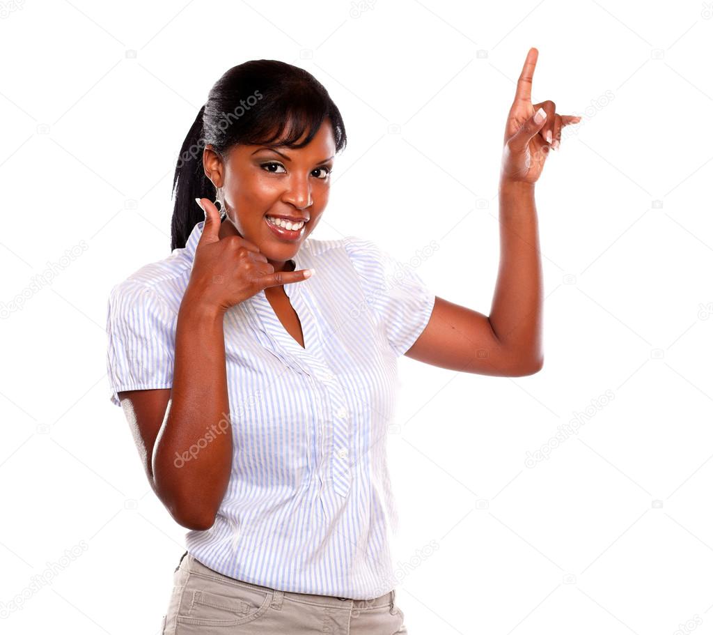 Smiling female pointing up saying call me