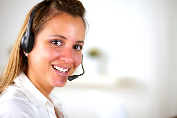 Charming young woman using headphones — Stock Photo, Image