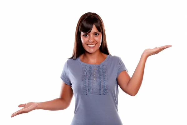 Smiling young woman looking at you with hands up — Stock Photo, Image