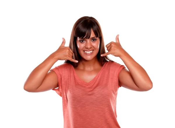 Smiling young woman saying call me with her hands — Stock Photo, Image