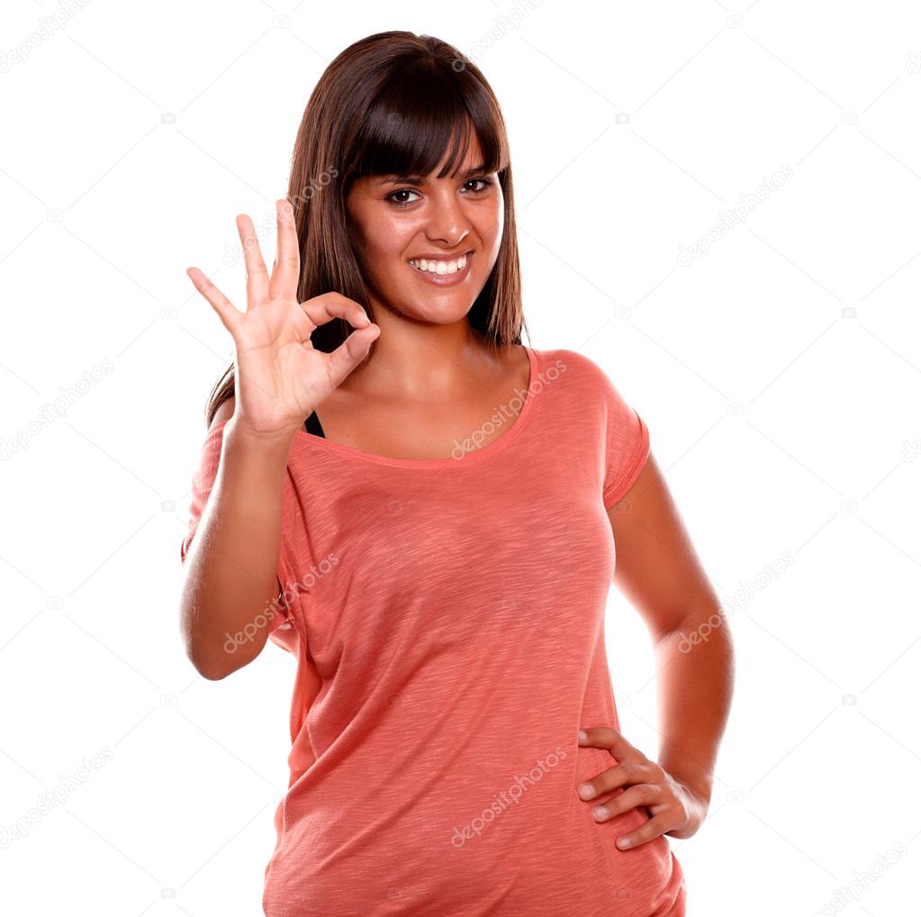 Charming young woman showing you ok sign