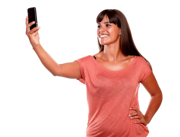 Young female taking a picture with her cellphone — Stock Photo, Image