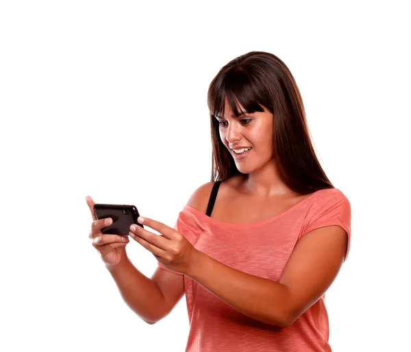 Pretty young woman sending message by cellphone — Stock Photo, Image