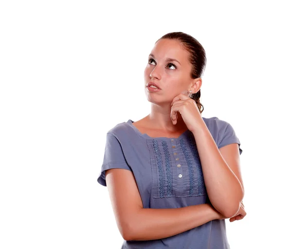 Pensive young female looking to her right up — Stock Photo, Image