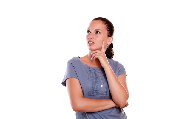 Reflexiva joven mujer mirando a su derecha hacia arriba —  Fotos de Stock