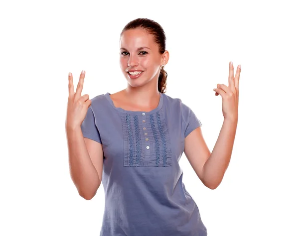 Charming young female showing you victory sing — Stock Photo, Image