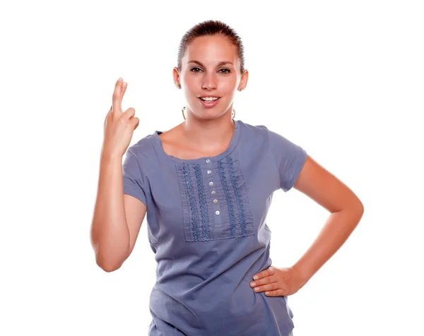 Charming young woman crossing her fingers — Stock Photo, Image