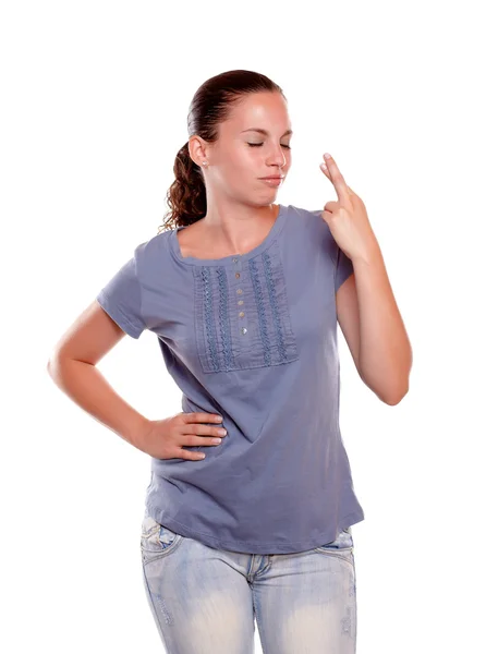 Young woman with eyes closed while making a wish — Stock Photo, Image