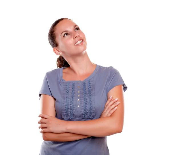 Smiling young woman looking to her left up — Stock Photo, Image