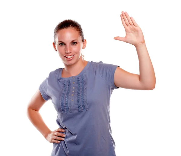 Smiling young woman looking at you and greeting — Stock Photo, Image