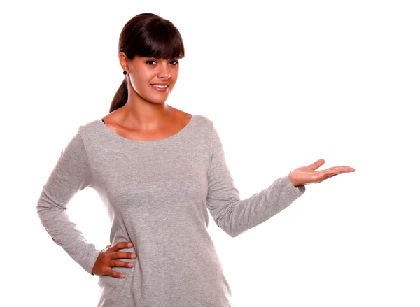 Young woman holding out her left palm copyspace — Stock Photo, Image