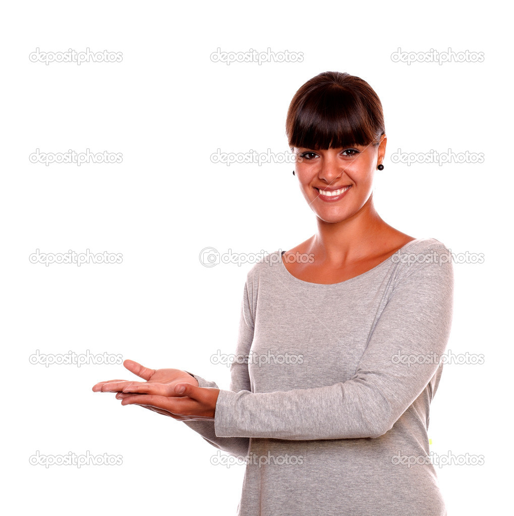 Young woman holding out her palm copyspace