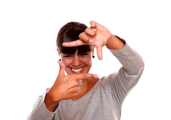 Charming young woman making frame shape with hand — Stock Photo, Image