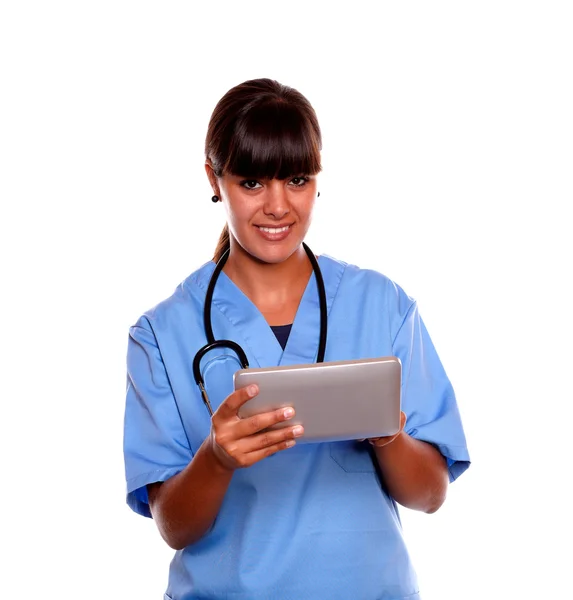 Smiling medical doctor woman using her tablet pc Stock Image