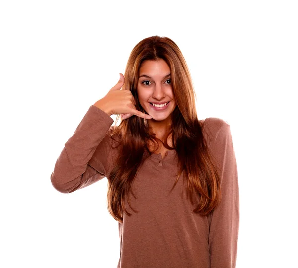 Smiling young female saying call me with her hand — Stock Photo, Image